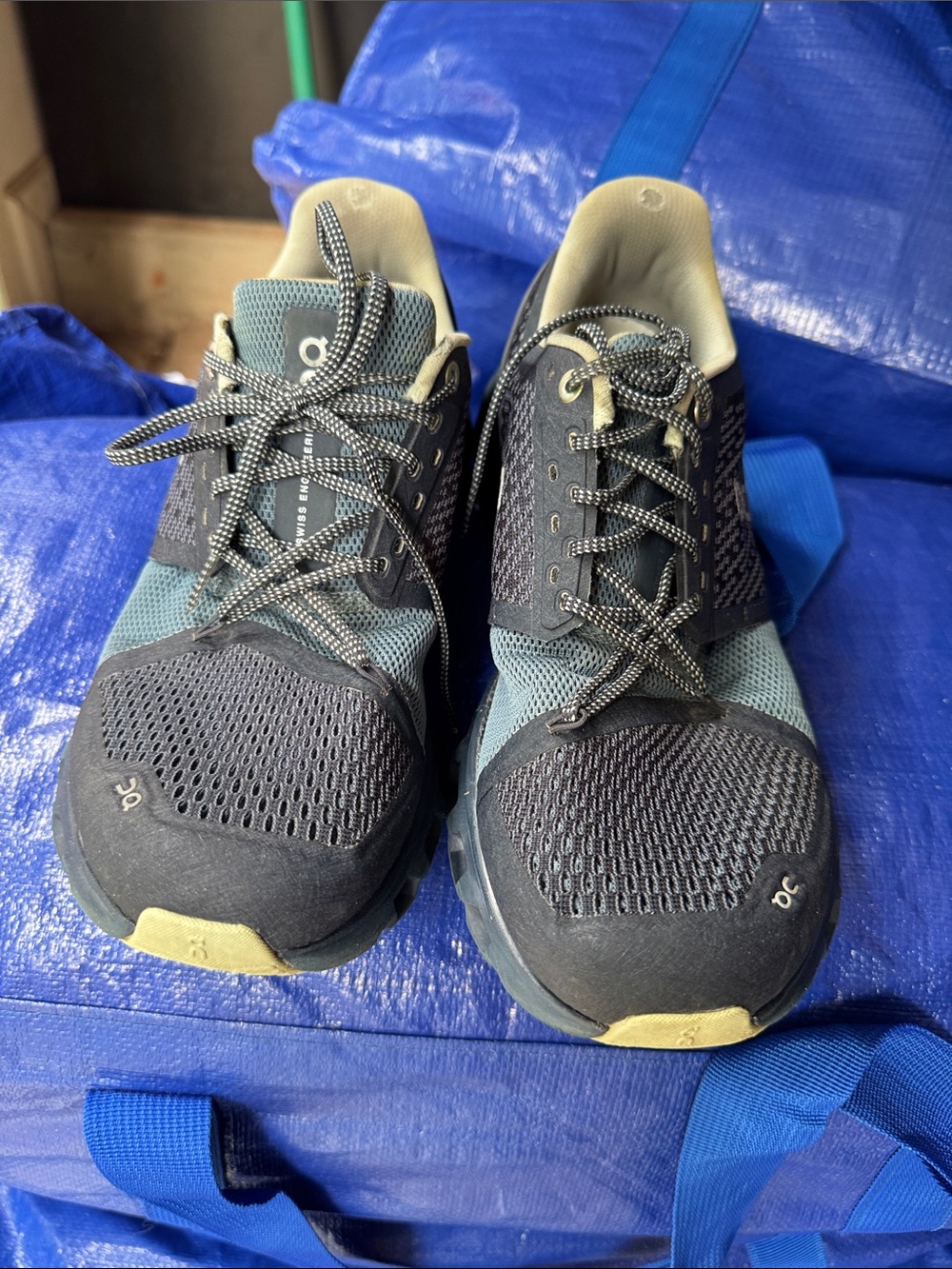 On Running Unisex Trail Shoes in Black and Blue with Cream Accents